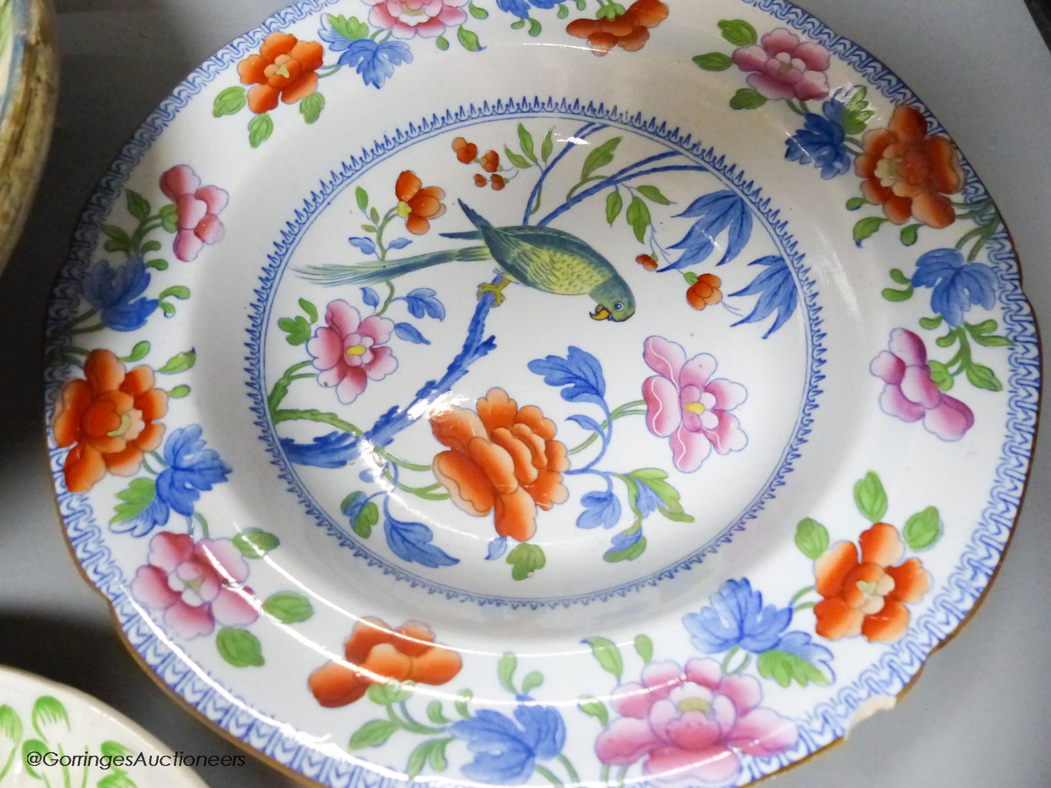 A Moroccan terracotta dish, an Ironstone dish, a green and white leaf dish, largest 30cm